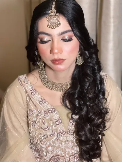 A close-up of the eye makeup. I used warm, golden tones to bring out the beauty of her eyes.