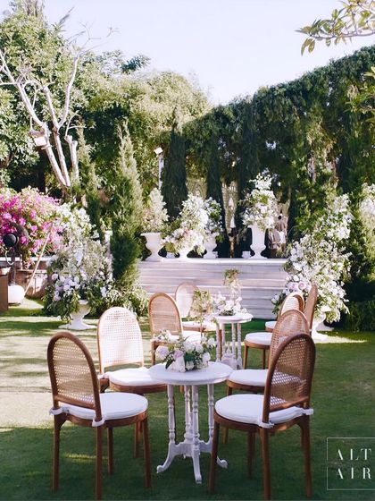 Alfresco seating in its perfect glory at our 'Romantic Garden' wedding in Bali. The classic cafe tables and chairs were set amidst lush greenery and floral installations.