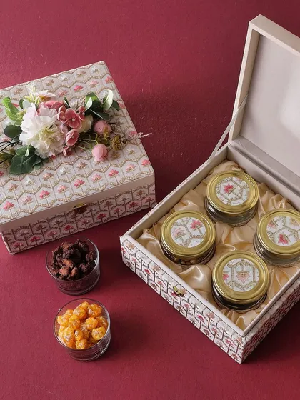 The Kamal Box is filled with flavorful vibes. It contains four jars of our best-selling gourmet nuts and cookies, including Rose Cashew, Mexican Trail Mix, and Honey Choco Almonds.