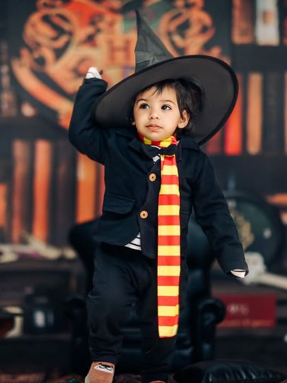 I'm not stubborn, I just have strong opinions. A confident little wizard adjusts his sorting hat in our magical Harry Potter studio.