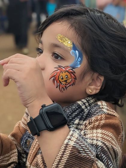 A cute lion cub design with a blue wave and a splash of gold glitter, perfect for a little king of the jungle.