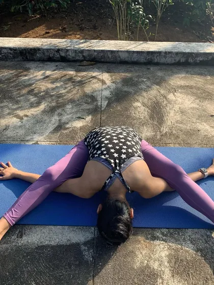 Prasarita Padottanasana, the wide-legged forward fold, is a deeply calming pose that stretches the hamstrings and inner thighs. Here I am finding stillness in the pose, connecting with the earth.