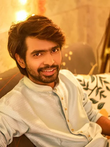 A relaxed portrait on the couch, surrounded by festive lights. This shows a more casual and intimate side of a festive shoot.