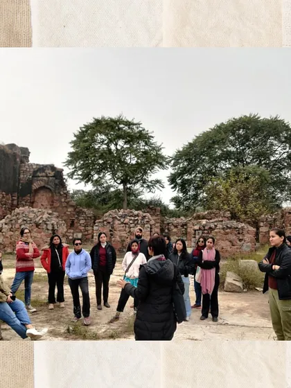 An engaged group listens intently within the palace complex of Tughlaqabad. We explore the series of courtyards, underground granaries, and residential quarters to understand life within the fort.