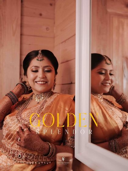 Titled "Golden Splendor," this image captures a bride's happy reflection as she gets ready.