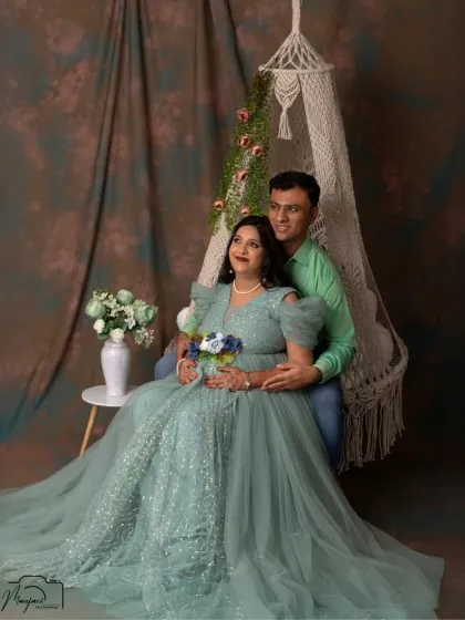 The swing setup is perfect for couples too. This shot captures a beautiful moment of connection, with the partner standing by her side in our dreamy studio setting.