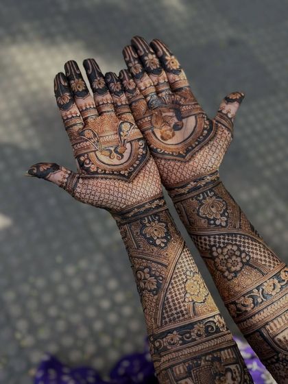 A different perspective of the custom bridal mehendi, highlighting the flow and composition of the various elements.