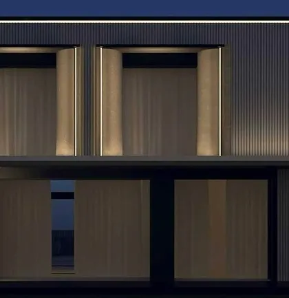 This design simulation shows how vertical light grazing can accentuate the ribbed texture of a building's facade. The lighting is integrated directly into the architectural form, making it appear seamless and intentional.