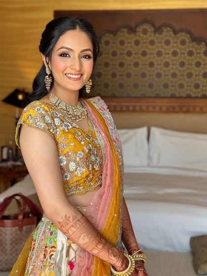 A bright and happy look for a Myra ceremony. The makeup is fresh and glowing, with a pop of color from the yellow outfit.