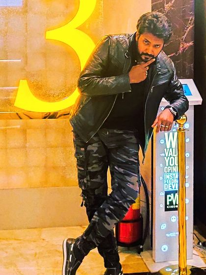 A stylish pose during an evening out. My personal style often reflects my artistic side. I believe in being bold and expressing yourself, which is what tattoos are all about.