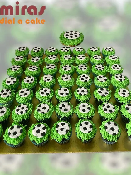 I prepared this large set of football-themed cupcakes for a corporate team event. Each cupcake is decorated with buttercream grass and a tiny soccer ball, making for a fun and shareable treat.