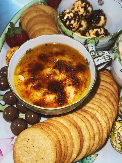 Our popular baked brie, brûléed on top for a sweet, crispy crust. It's served warm and gooey, perfect for dipping crackers and bread into.
