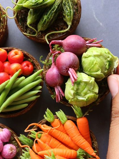 Another angle of my miniature vegetable baskets, showing the detail on the carrots and beets.