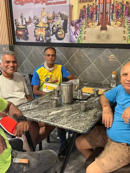 Sharing a meal on the road. The camaraderie between runners and crew is essential during a 200-mile race. We document these real, unscripted moments that define the ultra-running spirit.