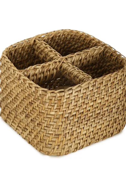 This woven cutlery holder is divided into four compartments, making it perfect for organizing utensils on a dining table or kitchen counter. Its natural texture adds a rustic touch to your home.