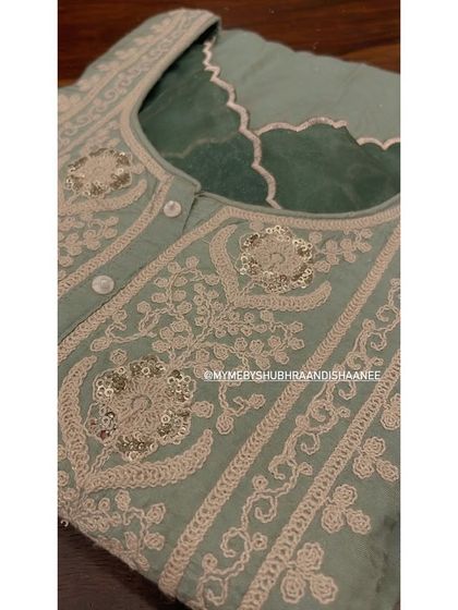 A close-up of a sage green kurta featuring delicate threadwork and sequin highlights. This image shows the precision and artistry that goes into every one of our embroidered pieces.