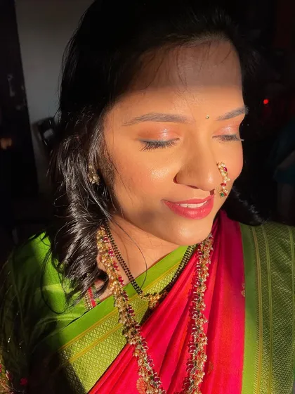 Glowing makeup for a wedding guest. The sunlight catches the beautiful shimmer on her eyes.