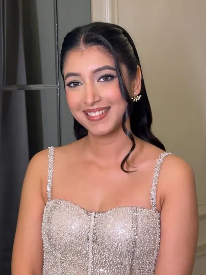 A close-up of Bhavya's birthday makeup. A classic winged liner and a warm nude lip create a look that is both elegant and fun.