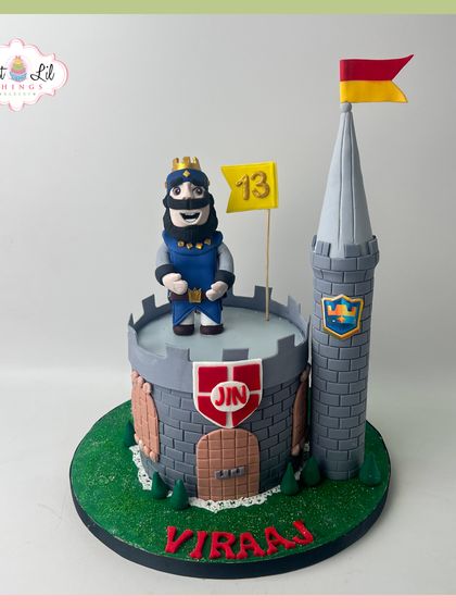 A cake fit for a Clash Royale champion. This castle-themed cake features the iconic King character from the popular mobile game, perfect for a 13th birthday.