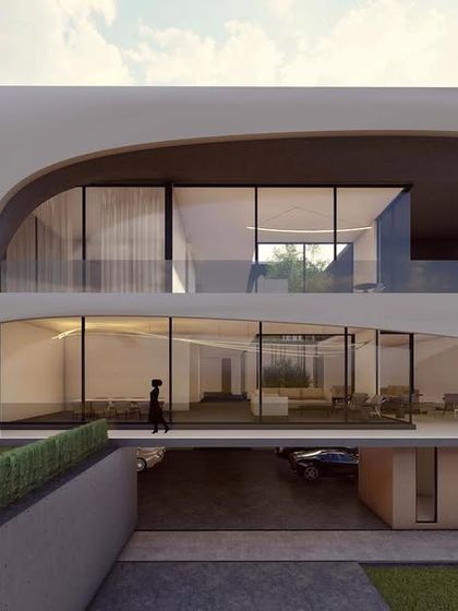 This design features dramatic, swooping curves that define its two main levels. A cantilevered ground floor creates a sheltered parking space, while the upper floor enjoys panoramic views through floor-to-ceiling glass.