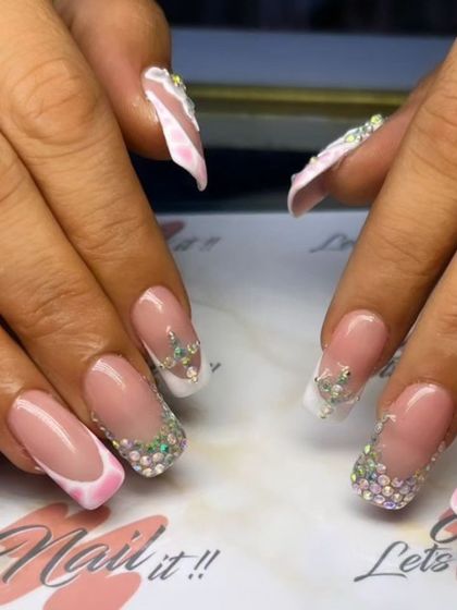 Another angle of the dazzling rhinestone-tipped French manicure.