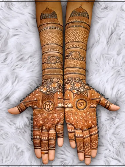 A classic full bridal design with incredible detail. The palms feature personalized initials, and the arms are covered in dense, traditional patterns including architectural domes.