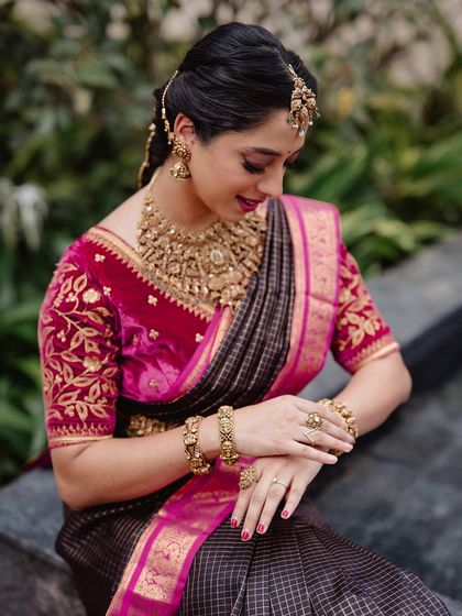 A close-up of Ansha's look, highlighting her beautiful makeup and the intricate details of her traditional jewelry.