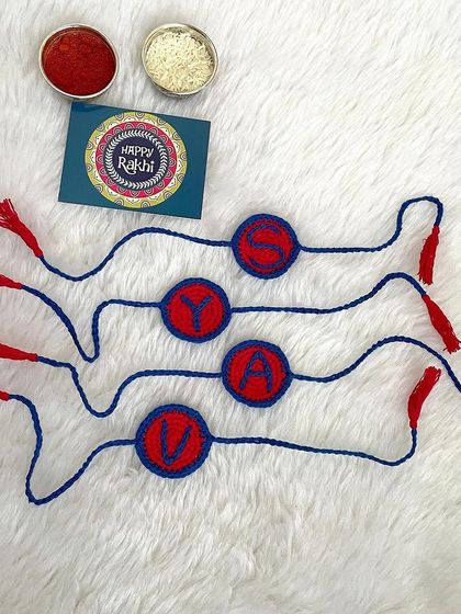I also offer personalized Rakhis with initials. This set was for four brothers, with each Rakhi featuring their first initial.