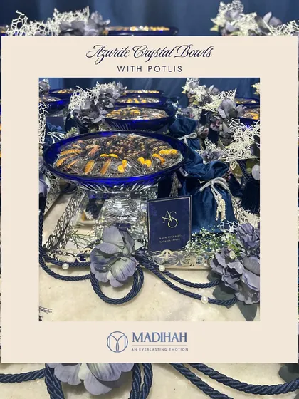 A product shot of the Azure Crystal Bowls with Potlis. This is a gift that combines the timeless luxury of crystal with the rich texture of velvet, perfect for thanking guests at an elegant wedding.