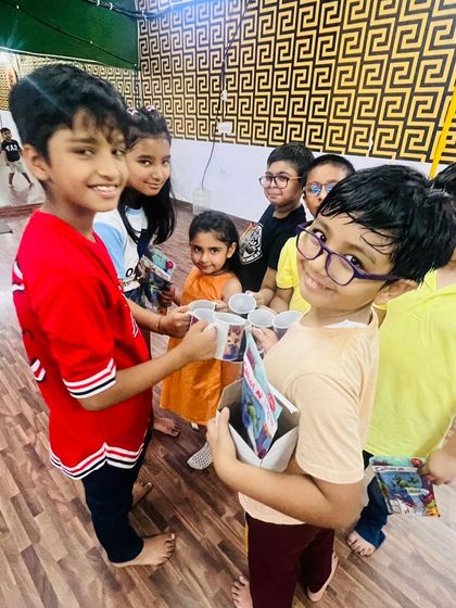 Kids sharing their prizes with each other. This shows the friendships and bonds that are formed during our enrichment programs.