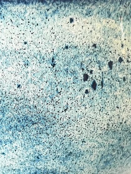 A macro shot of the textured glaze on the blue goblet. I love how the specks and variations create a universe of detail.