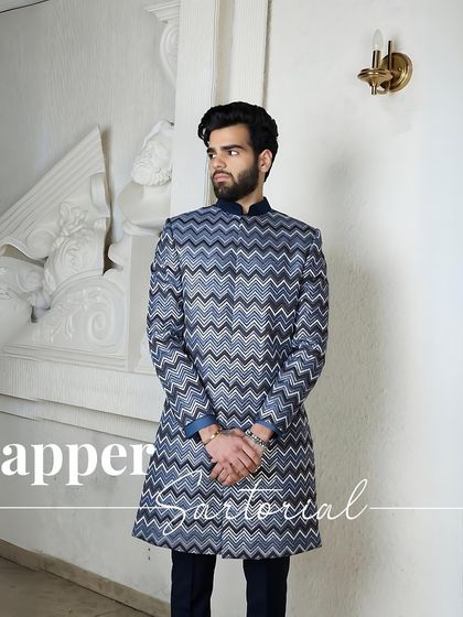Dapper Sartorial. A full-length look at the chevron-patterned kurta, showcasing its modern yet traditional silhouette that is perfect for the wedding season.