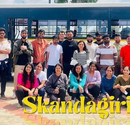 Our group posing for a photo in front of our transport before heading out for the Skandagiri trek.