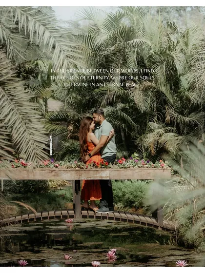A breathtaking shot of the couple on a wooden bridge surrounded by lush greenery and a lily pond. This image from a nature-filled pre-wedding shoot is the definition of an eternal, peaceful love.