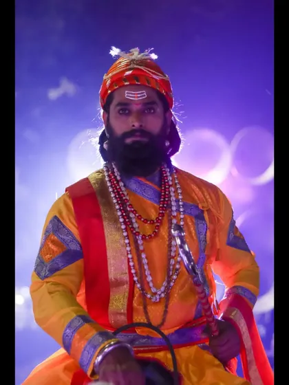 A powerful portrait of a model portraying Chhatrapati Shivaji Maharaj, set against dramatic lighting to honor the legacy of the great Maratha king.