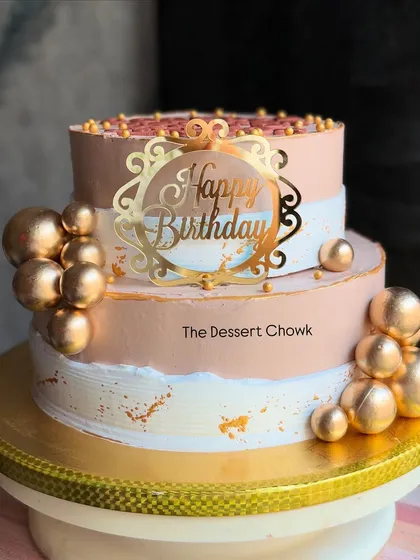 The full view of the stylish two-tier chocolate mousse cake, perfect for celebrating a milestone birthday or retirement.