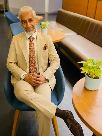 Here is a valued client, Mr. Rashid Khan, looking distinguished in a single-breasted beige suit I tailored for him. The ensemble is completed with a French double cuff shirt, demonstrating a perfect blend of classic style and personal fit.