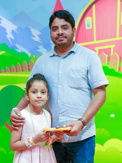 A father and daughter pose for a photo during our Father's Day event. I encourage families to celebrate these special bonds with a day of action-packed fun.