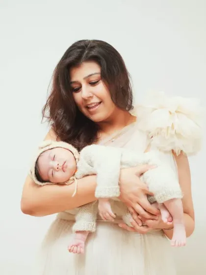 A mother's gentle embrace. This portrait highlights the peaceful and loving connection between a mom and her sleeping newborn.