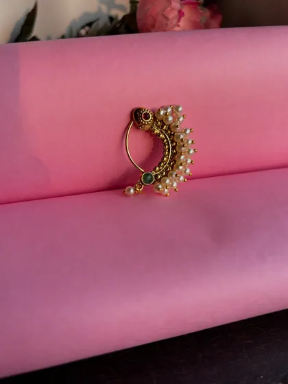 A still shot of the classic pearl Nath, a must-have for any traditional Maharashtrian event.