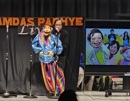 My father performing with a large, colorful puppet during our USA tour. He continues to inspire me and audiences worldwide.