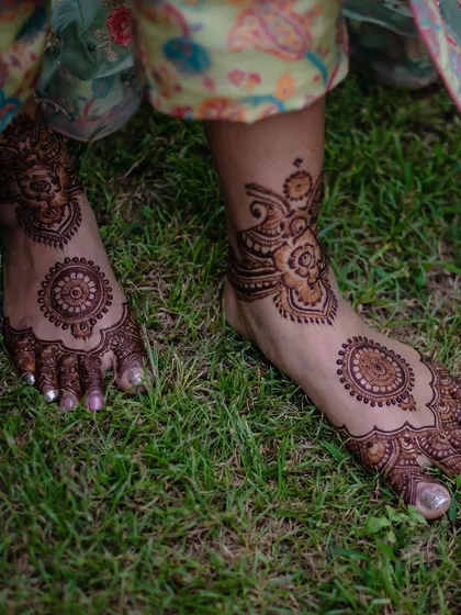 I believe in providing a complete look, which includes elegant feet mehendi. This design features a central mandala on the foot, complemented by a delicate pattern around the ankle, perfect for any bride or guest.