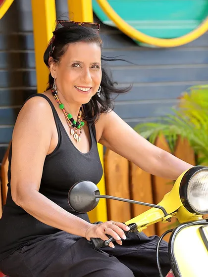 A joyful, candid moment with Swaroopa Ghosh on the scooter. Genuine smiles make for incredibly compelling and relatable photos.