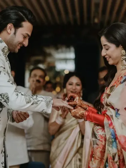 The ring exchange during the Greek-themed engagement brunch. A beautiful, intimate moment amidst the lively celebration.