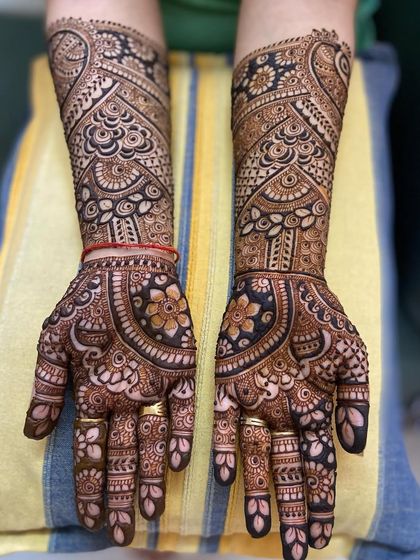 The same intricate floral mandala design, showing the beautiful symmetry and the dark, even stain.