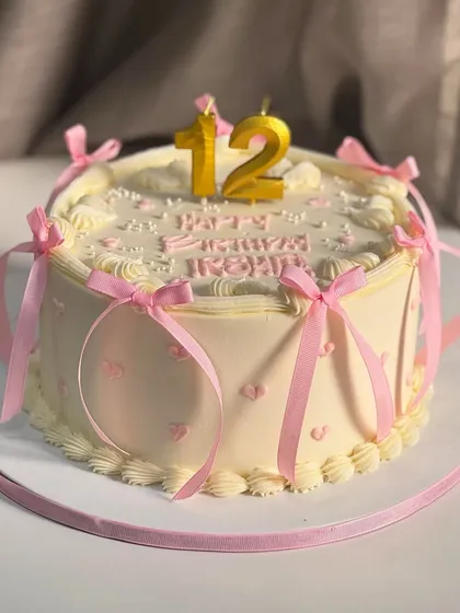 A little sweetness goes a long way. This soft-pastel birthday cake with pretty pink bows and a clean vintage finish is all about celebrating in the most elegant way.