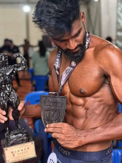 The goal is not just to look good, it's to win. Here is my client after becoming a champion, a testament to our contest prep protocol that covers everything from diet to stage presence.