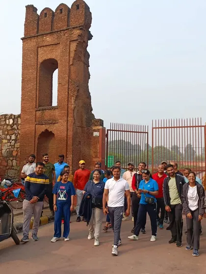 A corporate group from KLM walks through a historic gateway. We design engaging neighborhood explorations for our partners and their teams.