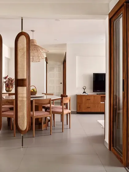 A complete transformation of a 40-year-old apartment into a Rooted Japandi Home. By removing walls and introducing natural materials, I created an open, bright, and warm space that seamlessly connects the kitchen, dining, and living areas.