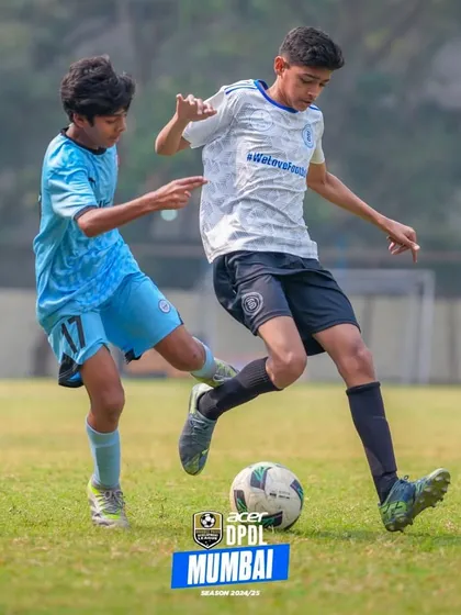 Great things happen to those who do not stop believing. A player battles for the ball in a tough match.